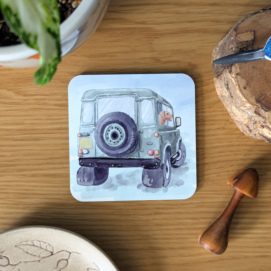 green land rover coaster with gundog