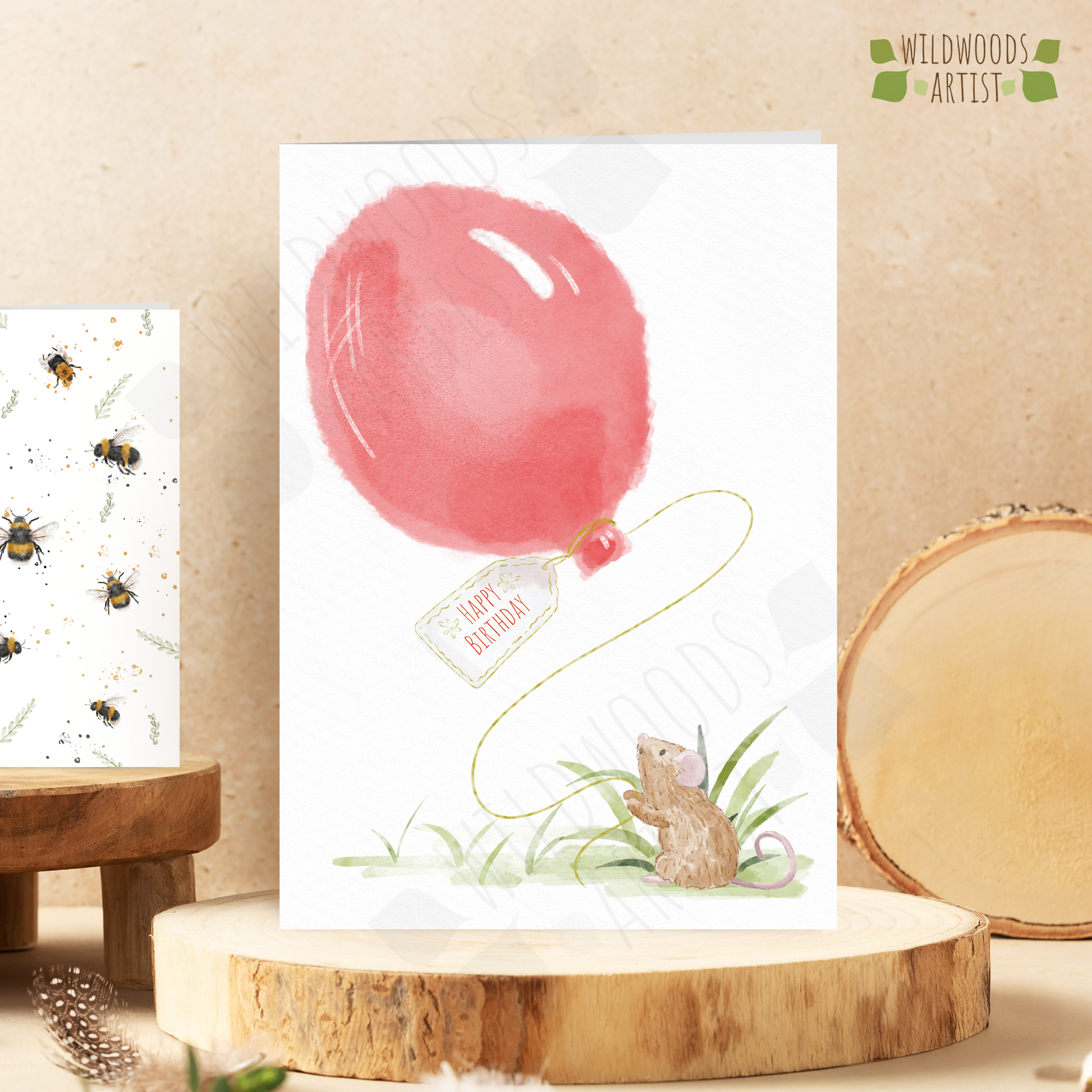 watercolour style mouse birthday card featuring an illustration of a mouse holding a giant red balloon