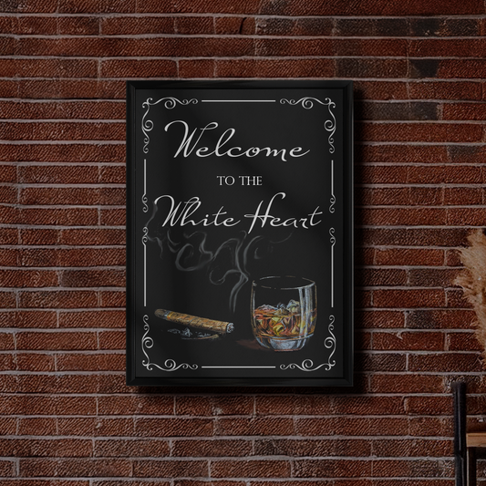 Framed indoor pub sign with 'Welcome to the White Heart' on a brick wall.