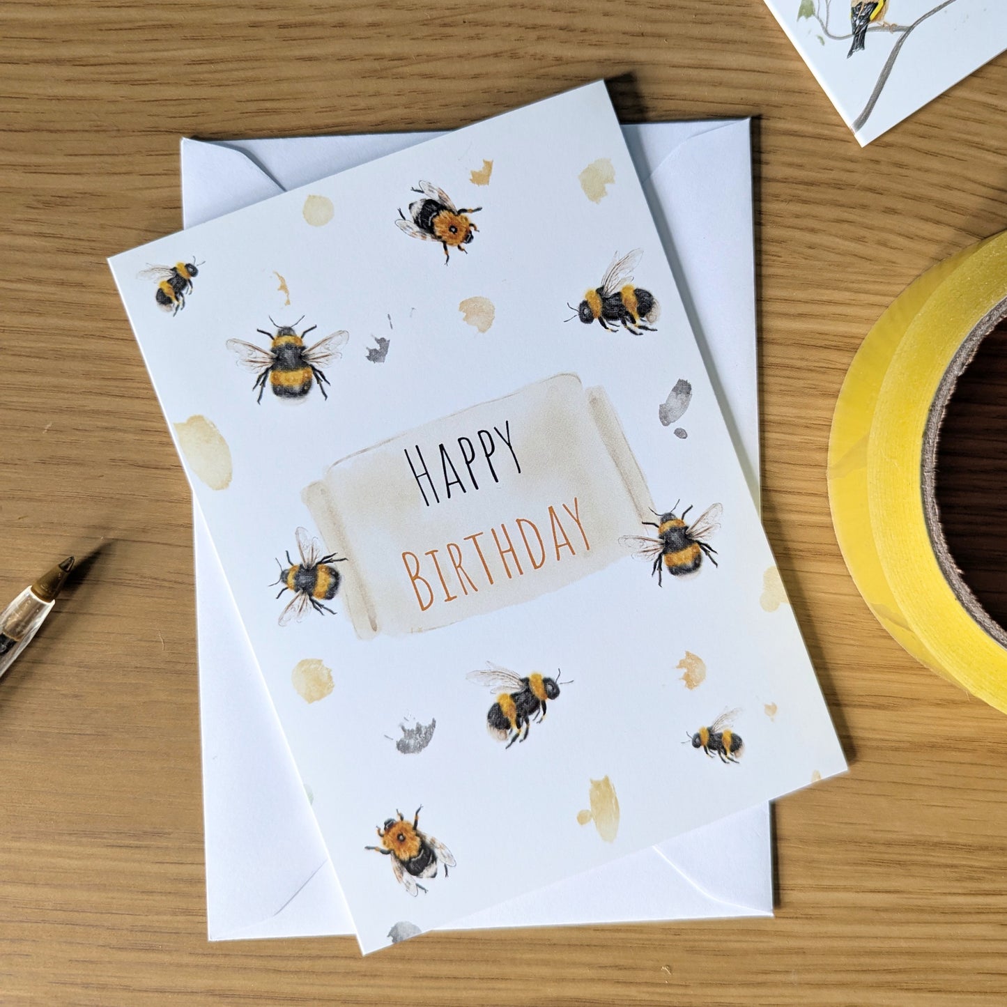 This bumblebee birthday card features a watercolour illustration of British bee varieties including the English bumblebee and tree bee